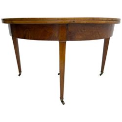 19th century mahogany demi-lune console table, hinged fold-over top with single drawer, on tapered supports with brass castors