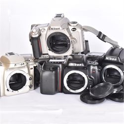 Collection of Nikon cameras, to include two F50 examples serial nos. 2966359 & 2243577, two F55 examples serial nos. 2608864 & 2024822, one with a AF Nikkor 28-80mm 1:3.3-5.6 G lens serial no. 3506212, F65 serial no. 2568057 and a F70 serial no. 2643064