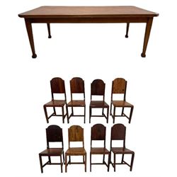 Mid-to-late 20th century teak dining table, rectangular top with canted corners, on square tapering supports with spade feet (214cm x 119cm, H76cm); and a set of eight Burmese reclaimed teak dining chairs, high arched back over panelled seat