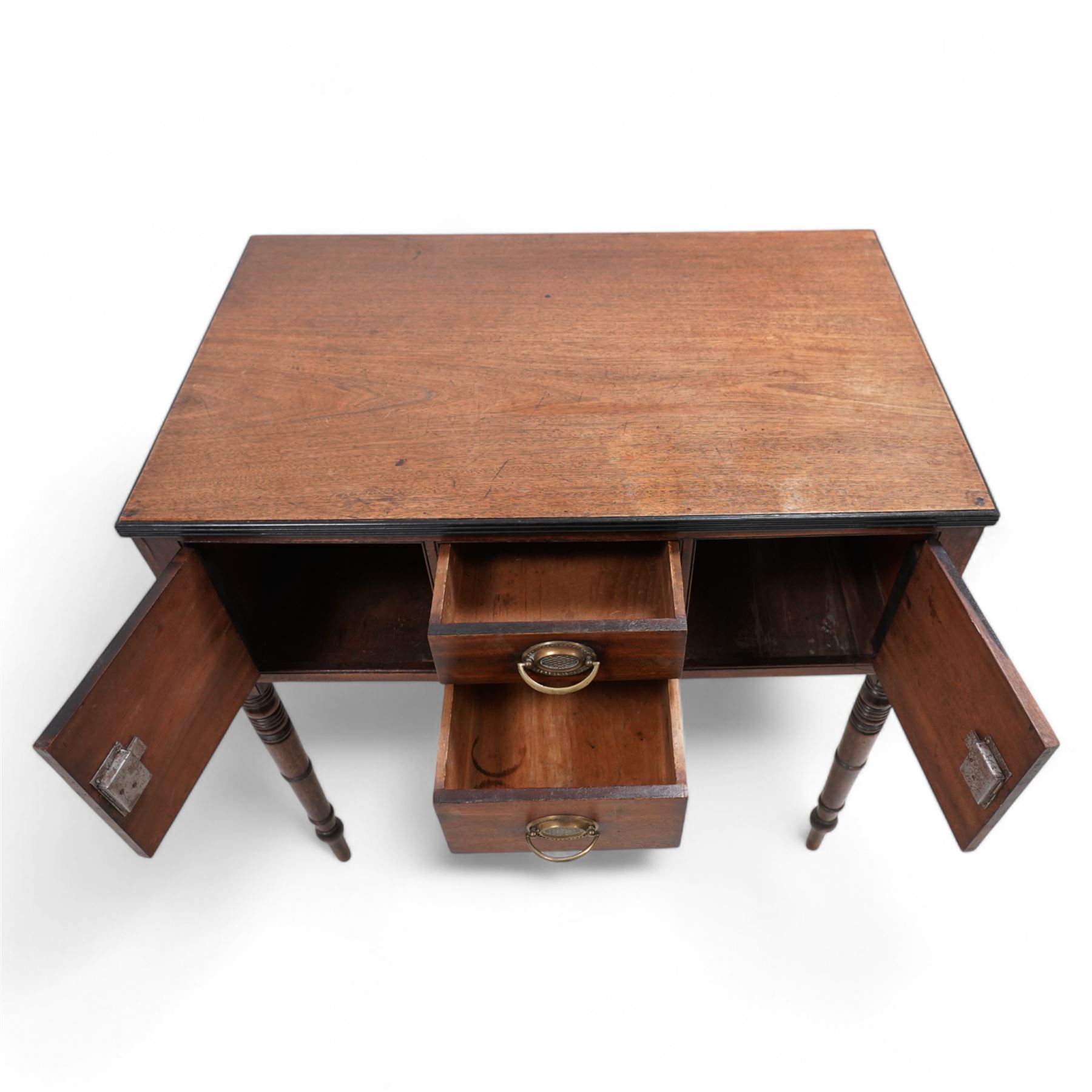 Georgian mahogany side table, rectangular reeded top over two small drawers and flanking cupboards, false drawer to the opposing side, fitted with carrying handles, on ring turned supports