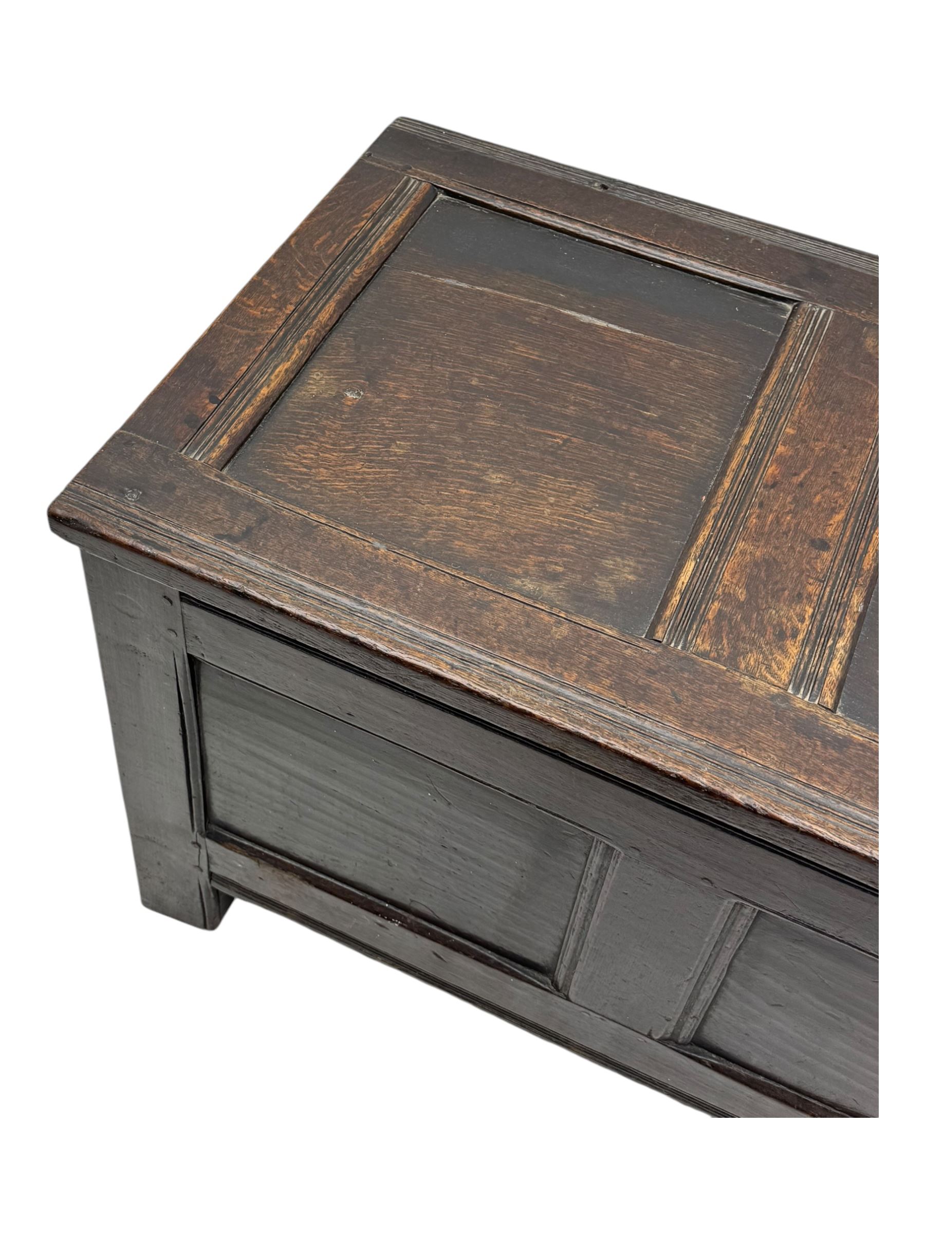 18th century oak blanket box, panelled hinged lid over panelled front, moulded frame, on stile supports 