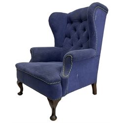 Early 20th century wingback armchair, upholstered in buttoned blue fabric, rolled and scrolled arms, on cabriole feet