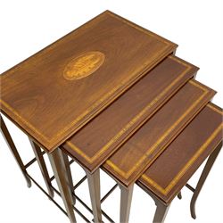 Edwardian inlaid mahogany quartetto nest of four occasional tables, each table with rectangular moulded top with satinwood band and central shell inlay, on square tapering supports with splayed terminals, inlaid with boxwood stringing