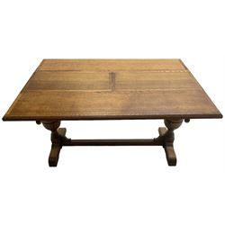 Early 20th century oak 'Ee-zi-Way one motion extending dining table', rectangular top over twin baluster end supports united by stretcher