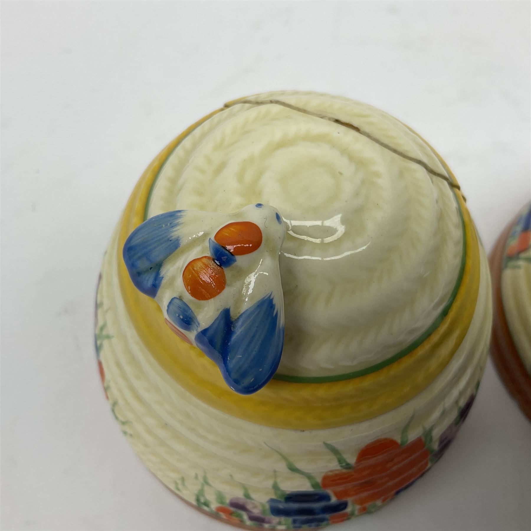 Two Clarice Cliff Bizarre for Newport Pottery, beehive honey pot with cover in Crocus pattern, with printed mark beneath, H9cm