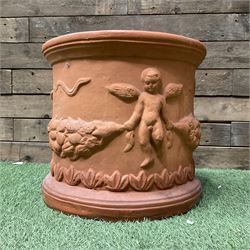 Circular terracotta garden planter, decorated with cherubs and terracotta urn on plinth - THIS LOT IS TO BE COLLECTED BY APPOINTMENT FROM DUGGLEBY STORAGE, GREAT HILL, EASTFIELD, SCARBOROUGH, YO11 3TX