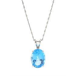 18ct white gold single stone oval cut Swiss blue topaz pendant, on 9ct white gold fancy li...