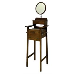 Early 20th century oak vanity stand, with circular adjustable mirror, brass towel rails to the sides, marble inset top and upper compartment, over additional storage compartment with hinged front, on splayed supports with stretchers