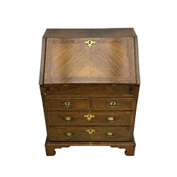 18th century walnut bureau, fall-front enclosing fitted interior with drawers and pigeonholes, over two short and two long drawers with brass escutcheon plates and handles, raised on bracket feet