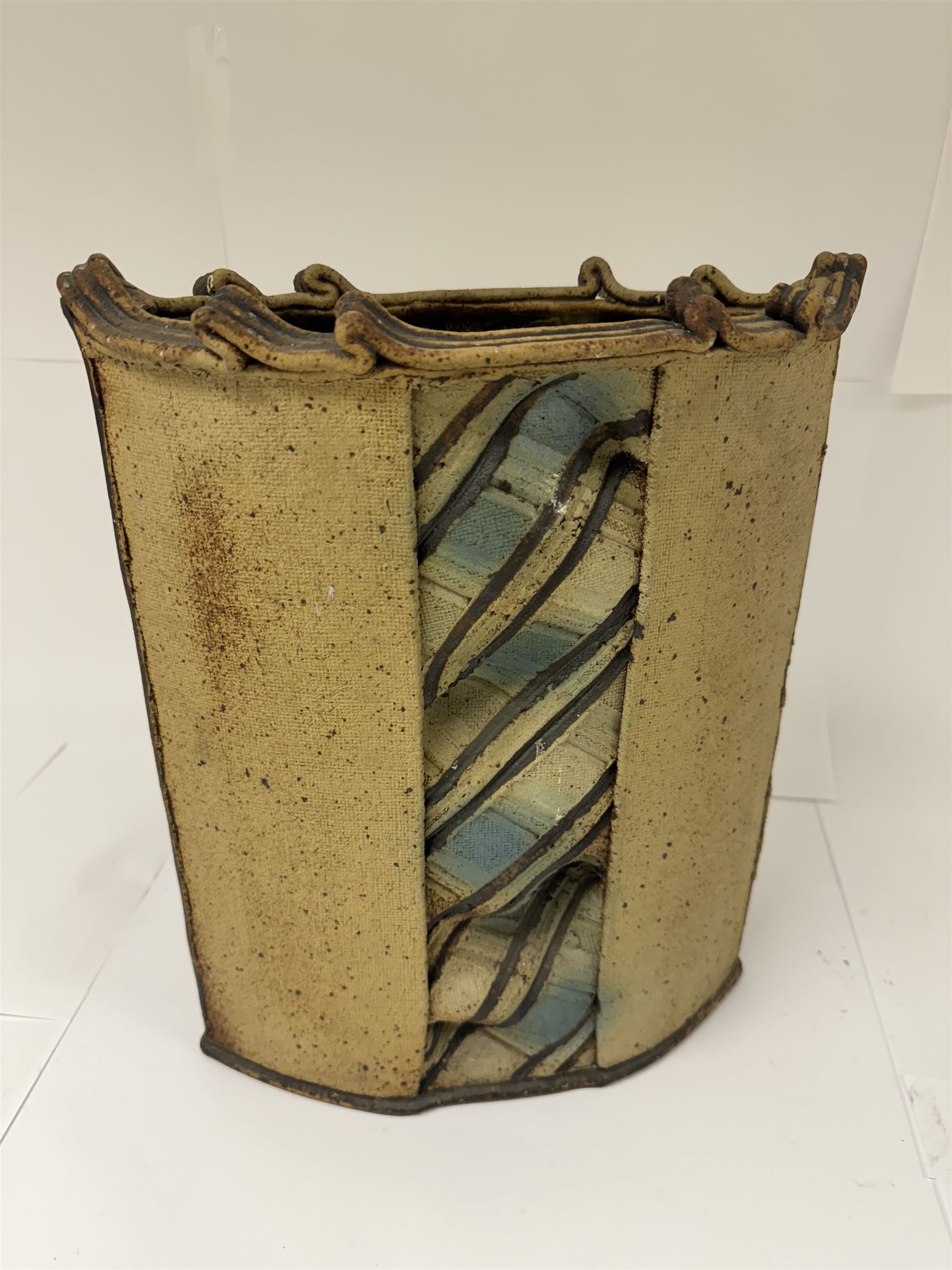 Jim Robison (American 1939-): slab built sculptural stoneware vase, of navette form with textured fabric effect decoration to centre, signed beneath, H35cm