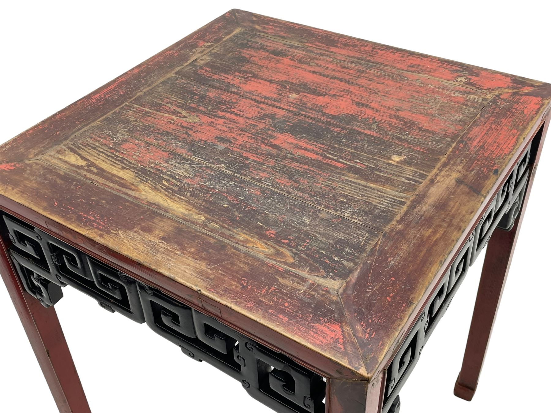 Late 19th century Chinese Qing dynasty red and black lacquered wood tall tea table, Shanxi region, square top over geometric scroll fretwork panels, on square supports with hoof feet 