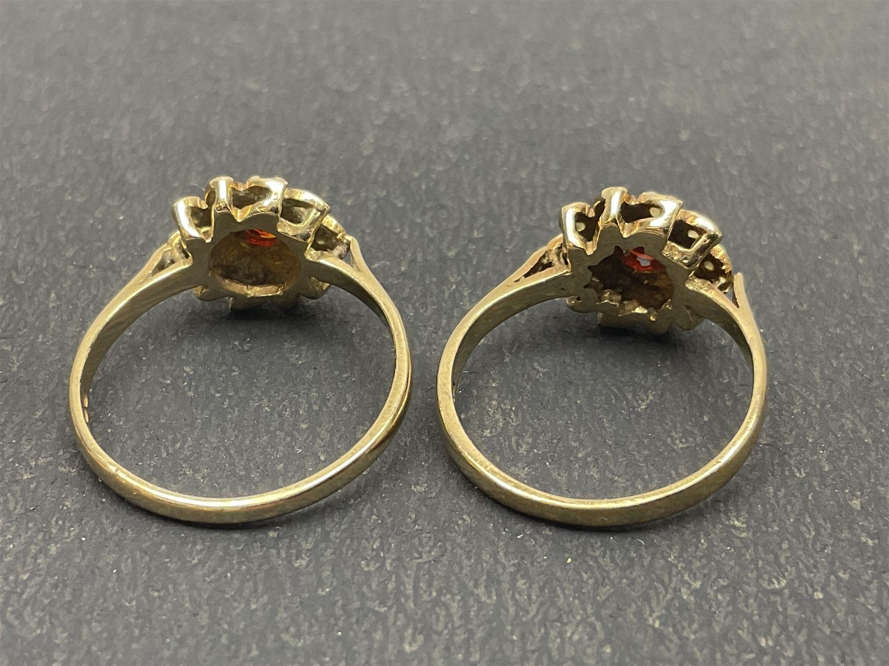 Two 9ct gold garnet and paste stone set cluster rings and a Early 20th century gold brooch, stamped 9ct