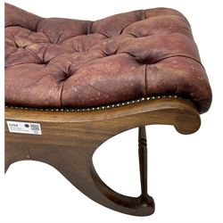 Late 20th century mahogany curved x-framed footstool, upholstered in buttoned red leather, splayed supports united by turned stretchers 