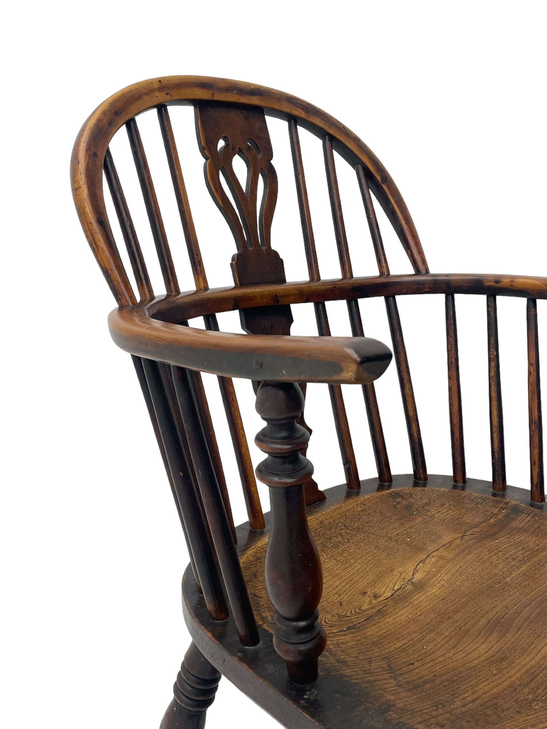 19th century yew wood and elm Windsor armchair, low double hoop stick and pierced splat back, dished seat on turned supports united by crinoline stretchers