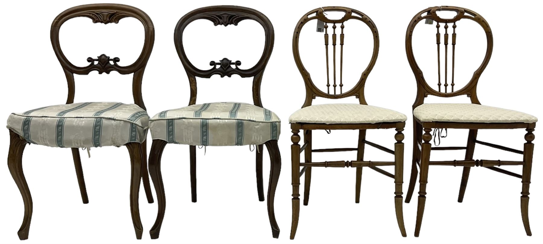 Pair of Victorian walnut balloon back dining chairs, scrolled and pierced cresting rail over cartouche carved middle rail, upholstered seats on cabriole supports; pair of Victorian walnut balloon back bedroom chairs, pierced cresting rail over turned spindle back, drop-on seat cushion over cane seat on turned supports united by turned stretchers (4)