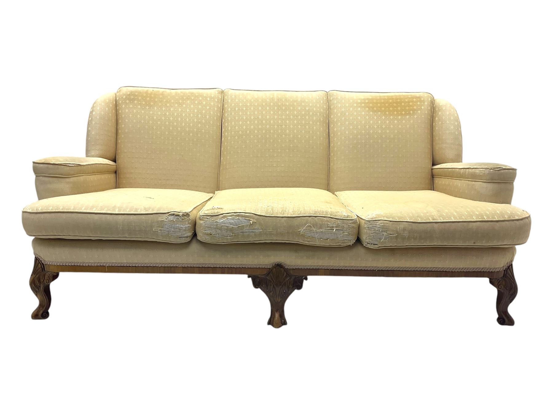 Late 20th century mahogany framed three seat sofa, upholstered in cream fabric with repeating cross pattern, raised on cabriole supports (W192cm, D98cm, H89cm); matching armchair in light pink fabric (W92cm, D98cm, H89cm) 