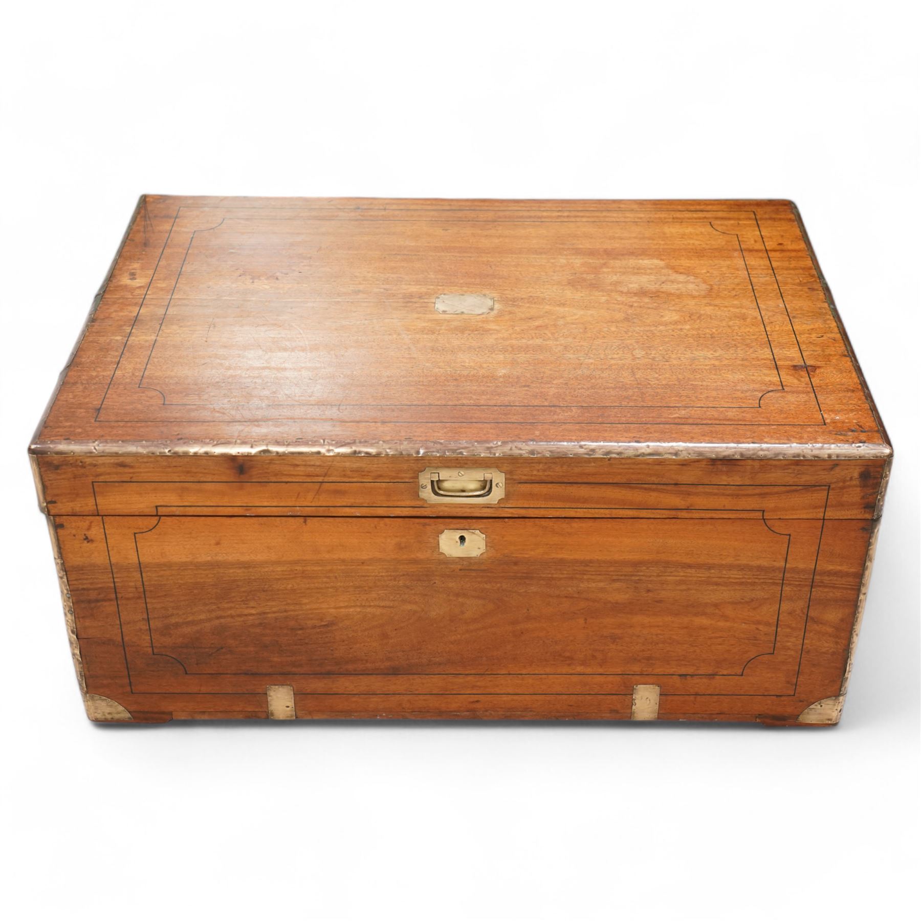 19th century camphor wood and brass mounted campaign chest, hinged lid with recessed brass handle enclosing vacant interior, mounted by brass edging and bands 