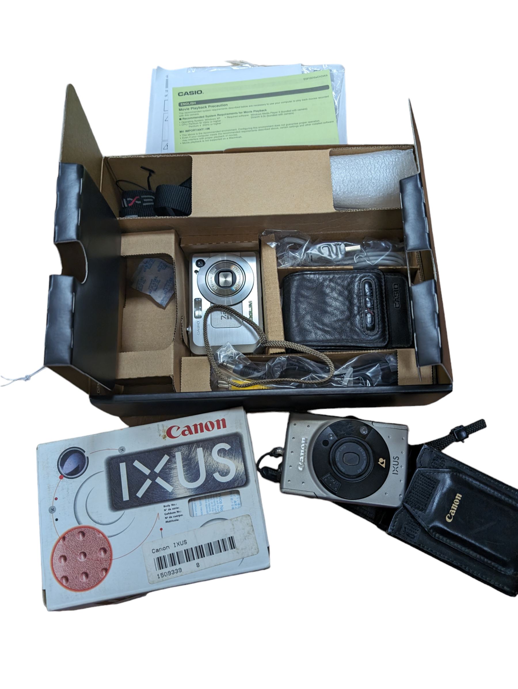 Casio Exilim EX-Z750 digital camera, and two Canon Ixus cameras, two examples boxed 