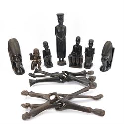 Mid 20th century carved African items, including pair of bookends, figure of a man, four t...