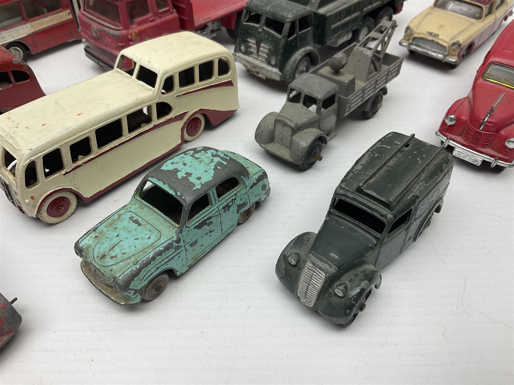 Dinky - sixteen unboxed and playworn die-cast models to include Single Deck Bus, two Atlantean Buses, Ford Transit Van, 10 Ton Army Truck, MGB Sports Car, Telephone Service Van etc 