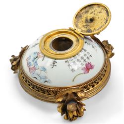 19th century Chinese porcelain famille rose inkwell, painted with figures from the Wu Shuang Pu to include Jiao Xiao Ran and Li Bai, mounted with ormolu style gilt metal mounts, including a floral hinged cover, pierced gallery base, on three rose stem supports, L13cm x H9cm