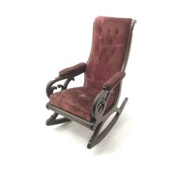 Victorian library style mahogany framed rocking chair, upholstered in a deep buttoned red fabric
