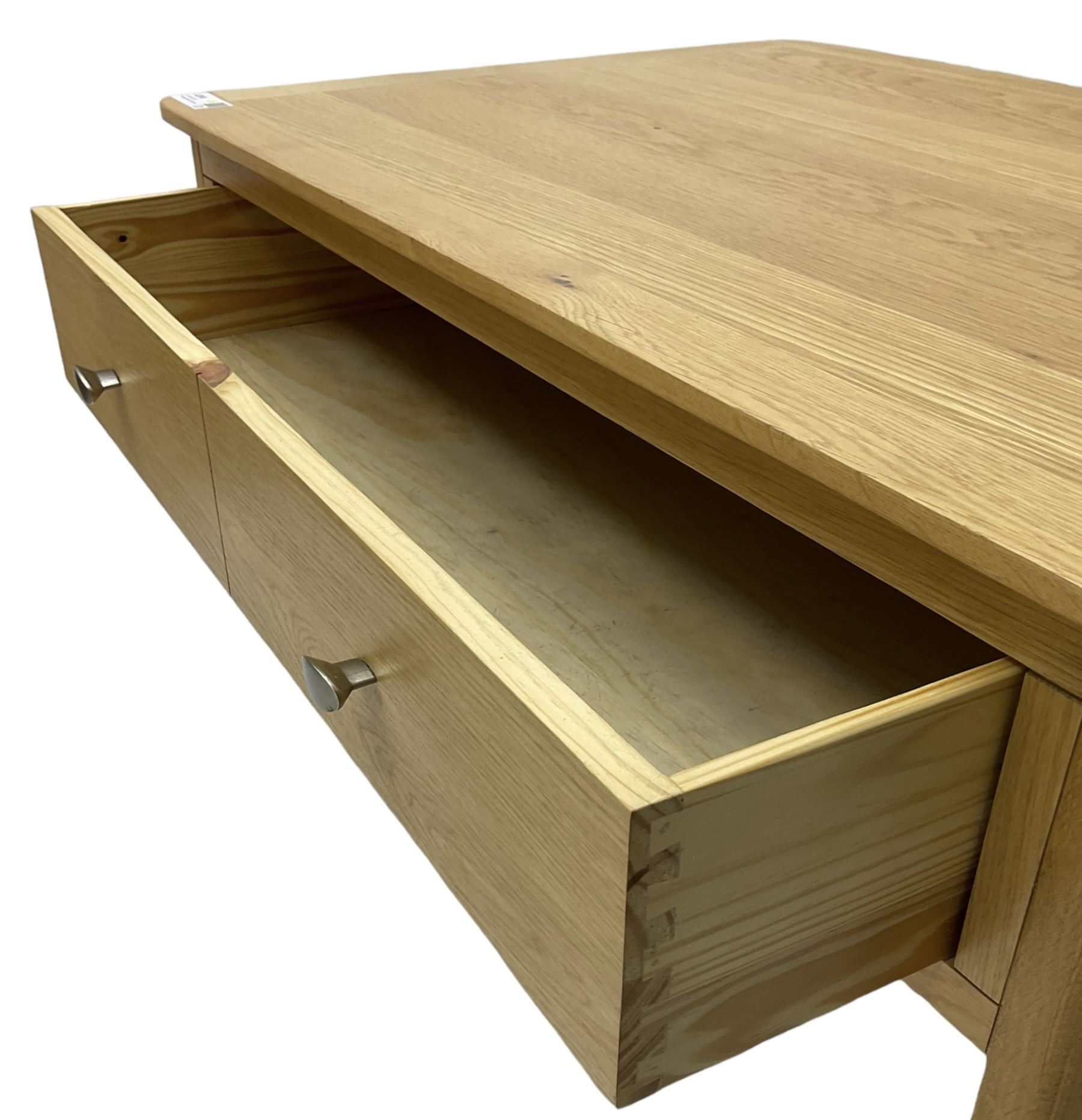 Contemporary light oak rectangular coffee table, fitted with single drawer disguised as two drawers to each side, on tapering supports