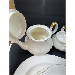 Royal Albert Val D'or part tea and dinner service, including two coffee pots, two teapots, milk jug, covered sucrier etc together with matching items 
