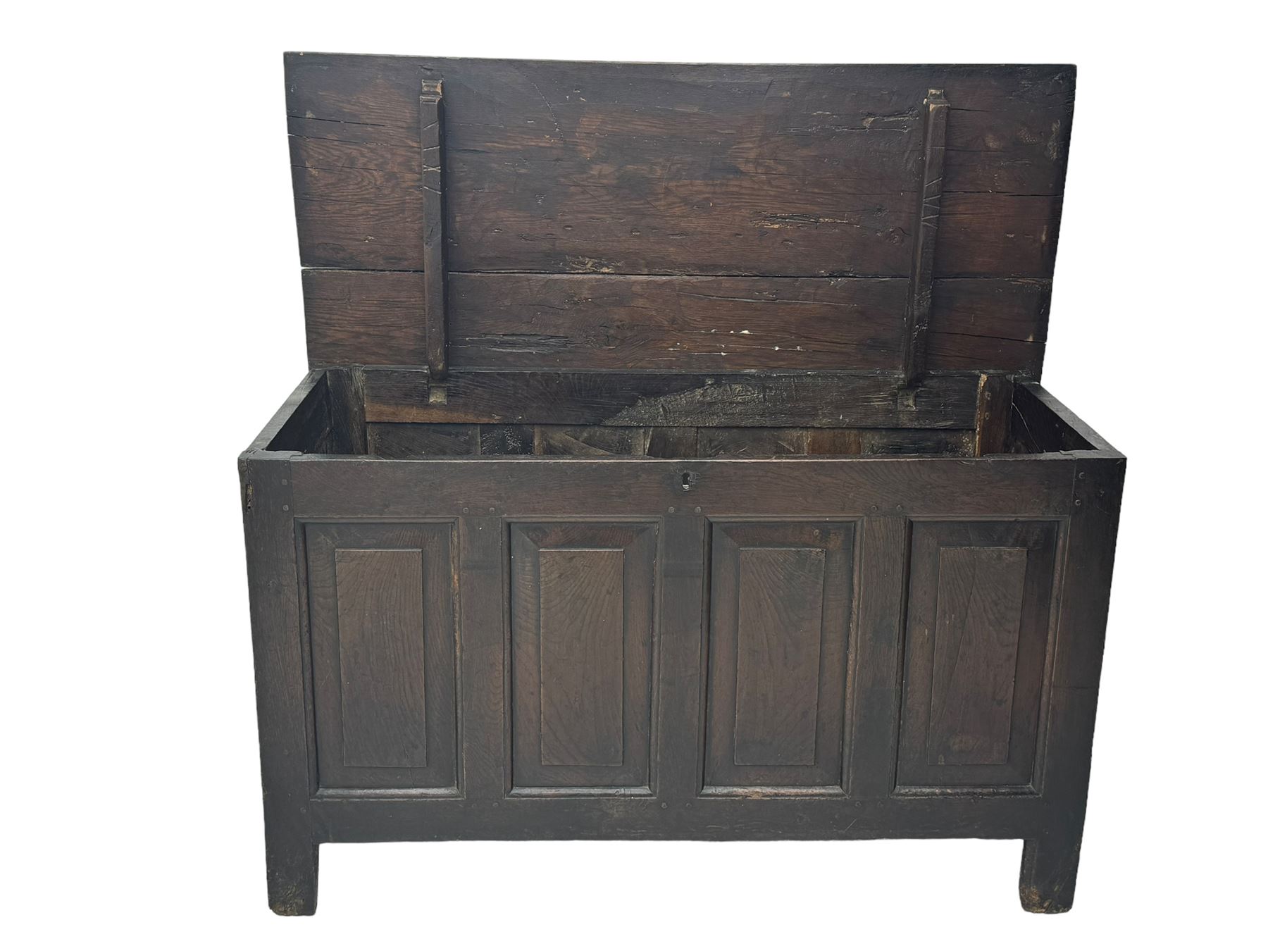 18th century oak coffer, rectangular plank lid over four panelled front and panelled sides, on stile supports 