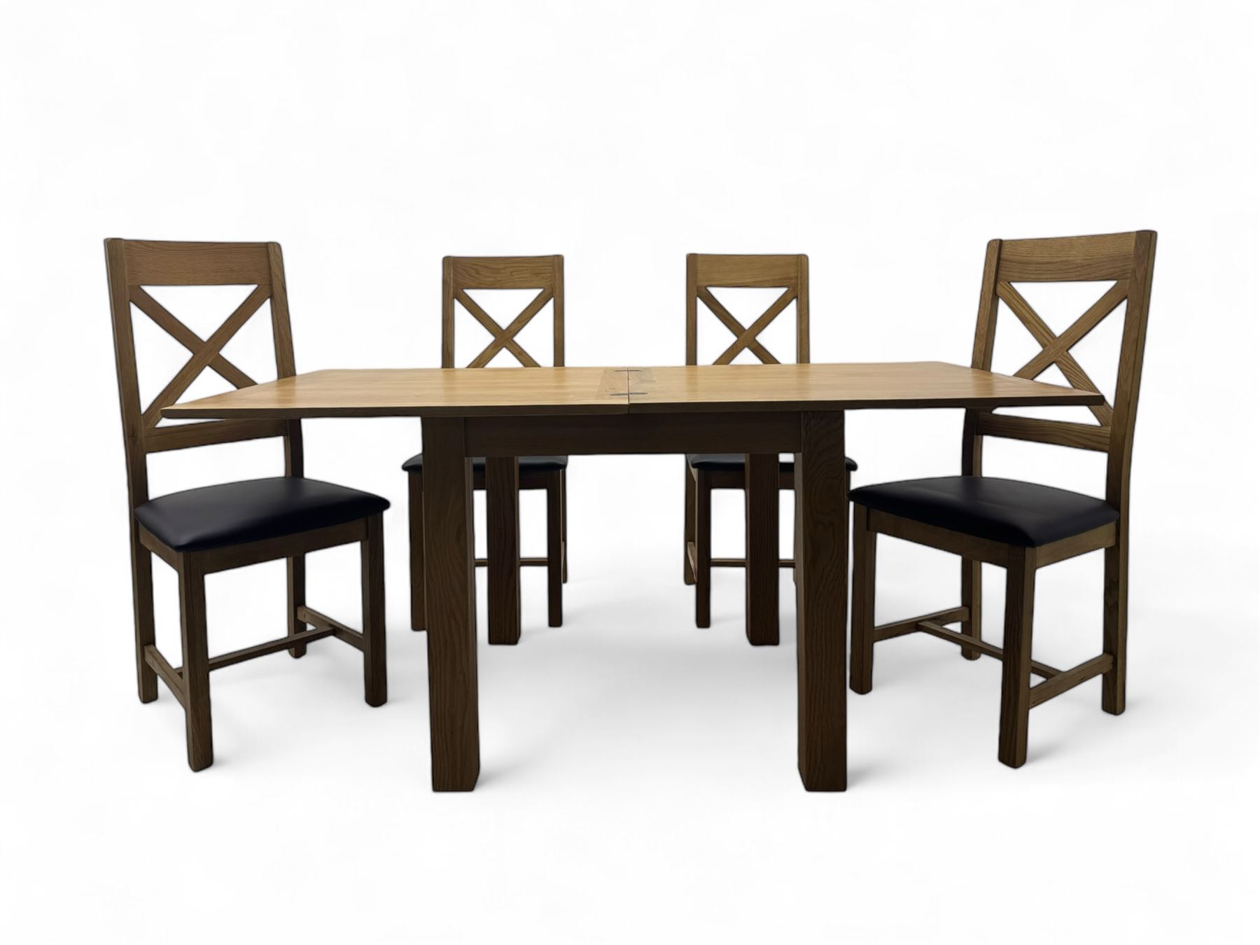 Oak extending dining table, square pull-out action top with folding butterfly leaf, on straight square supports; set of four dining chairs, X-shaped backrest and black upholstered seat, on square supports united by H-stretcher