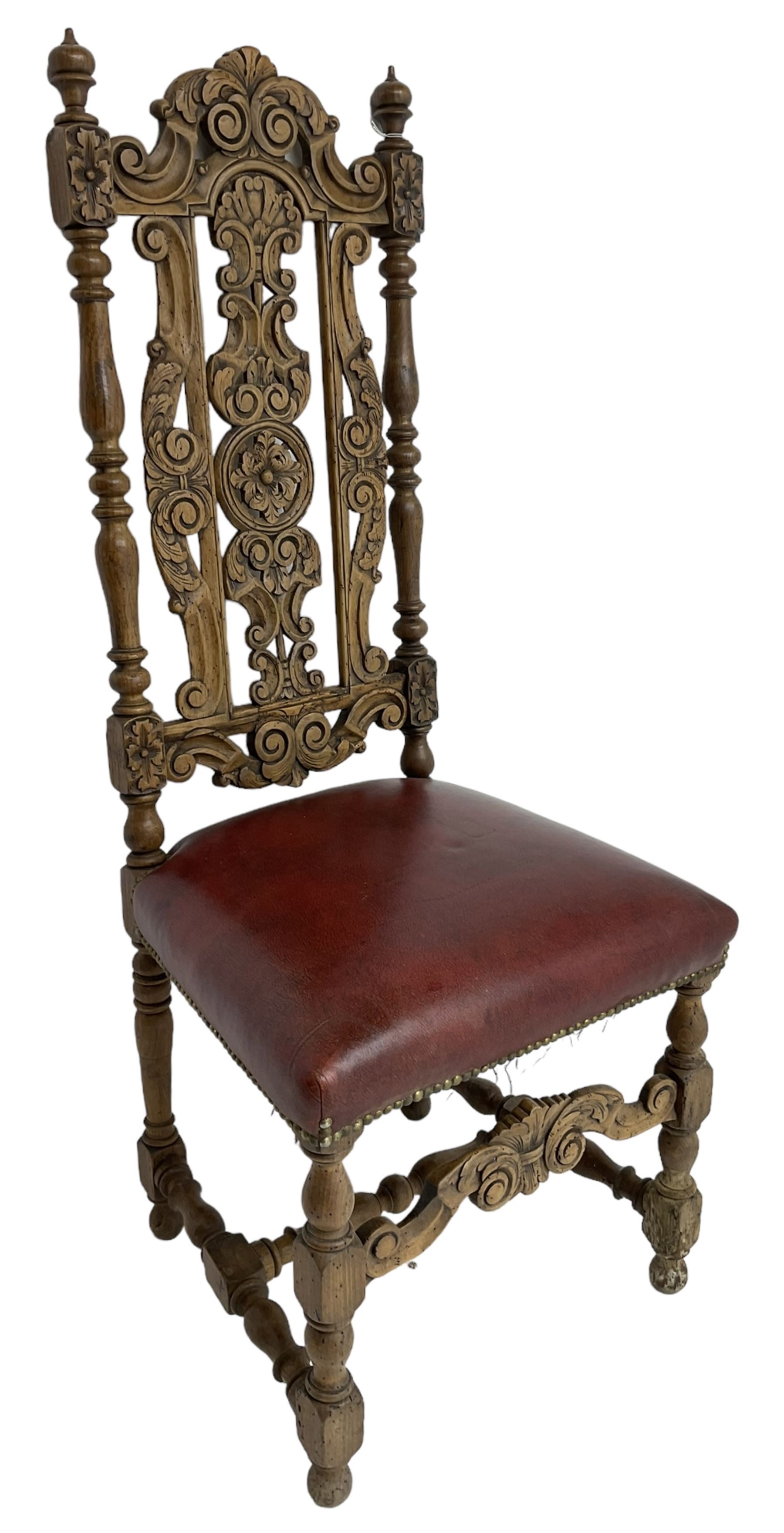 Carolean design oak high-back chair, the cresting rail carved with S-scrolls and foliage, the splat with a central flower head decorated with extending scrolls and acanthus leaves, upholstered seat, on turned and block supports united by S-scroll carved middle rail and turned stretchers