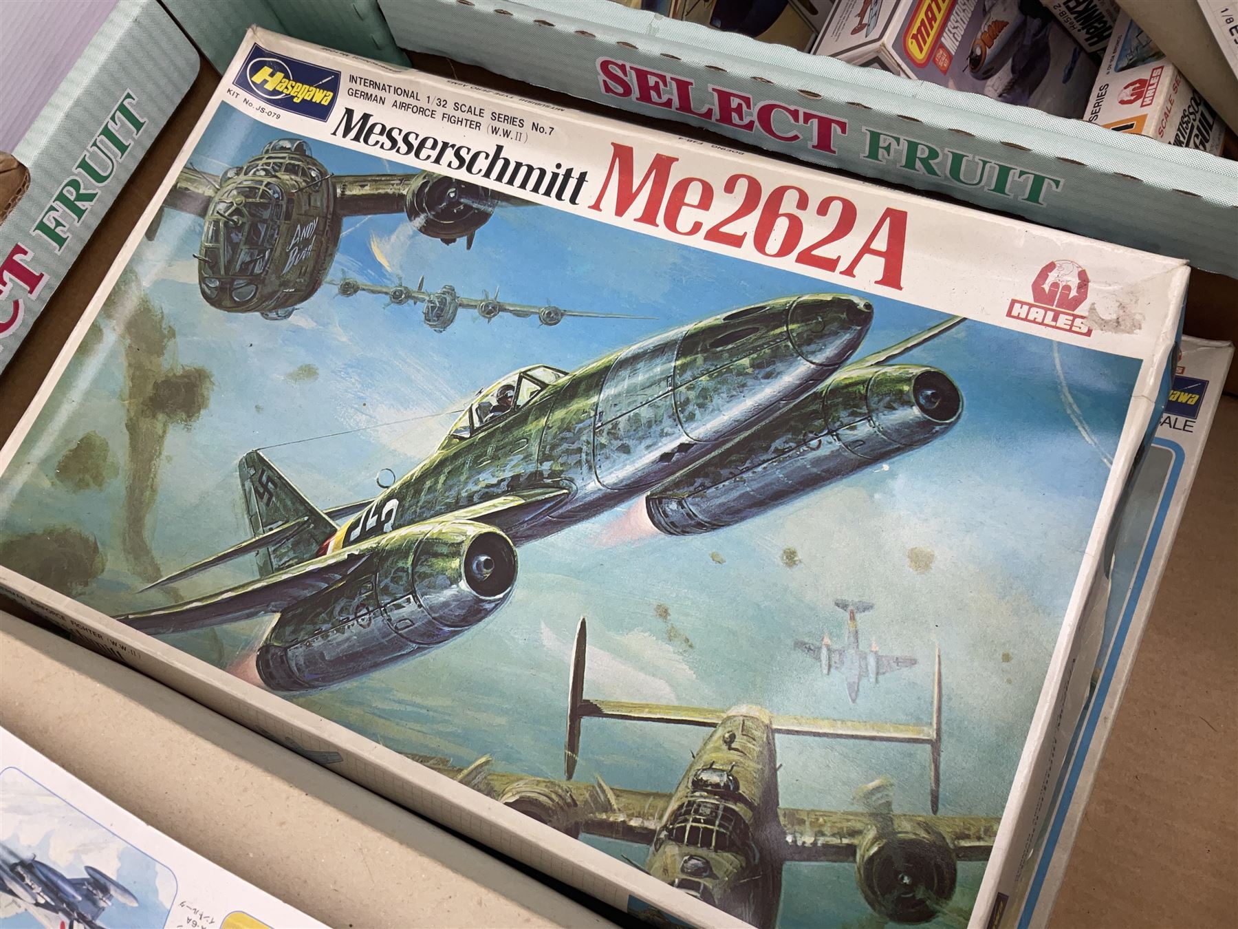 Twelve scale model kits, comprising ten model aircraft kits from Hasegawa, Nichimo, Fujimi and Matchbox, and two further Hasegawa 1:8 scale aircraft mounted machine gun kits, in two boxes 