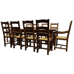 Antix Furniture - oak extending refectory dining table, rectangular plank top with two additional leaves and two drawers to the longer side, on square supports connected by H-stretcher; set of ten (8+2) ladder back dining chairs with rush seats