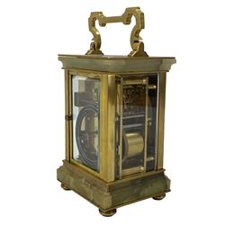 French - early 20th century two train carriage clock, in an onyx serpentine case raised on bun feet, with four bevelled panels and rectangular escapement viewing panel, white enamel dial with Roman numerals and steel spade hands, 8-day movement with a jewelled lever platform escapement and rack striking, sounding the hours and half hours on a coiled gong. With key.