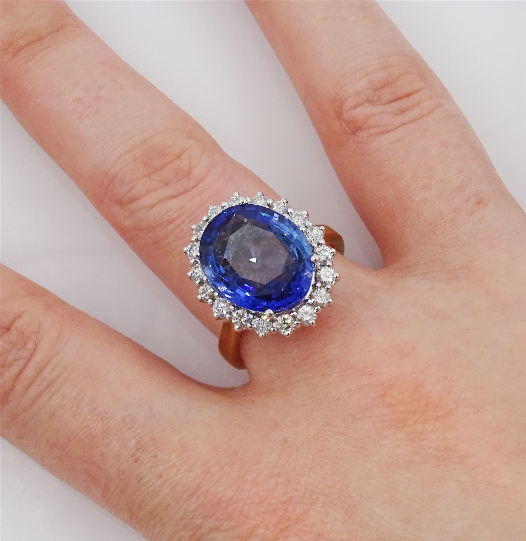 18ct gold oval cut unheated sapphire and round brilliant cut diamond ring, sapphire 7.46 carat, total diamond weight approx 0.70 carat, with Reunigem-Lab report