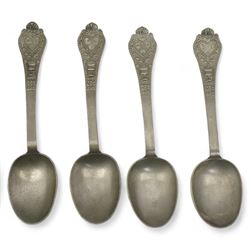 Four 19th century Dutch pewter trifid spoons by Hendrik Kamphof, the shell relief cast finial decorated with a vase of flowers surrounding a heart with the initials 'LF' to two and 'CD' to the two others, Crowned rose with the initials 'HK' struck on the back, L19cm, together with other Dutch pewter spoons and shallow bowl, the base inscribed 'DAM', D33.5cm 