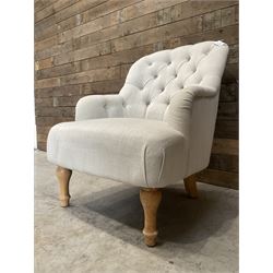 Armchair upholstered in button back linen fabric