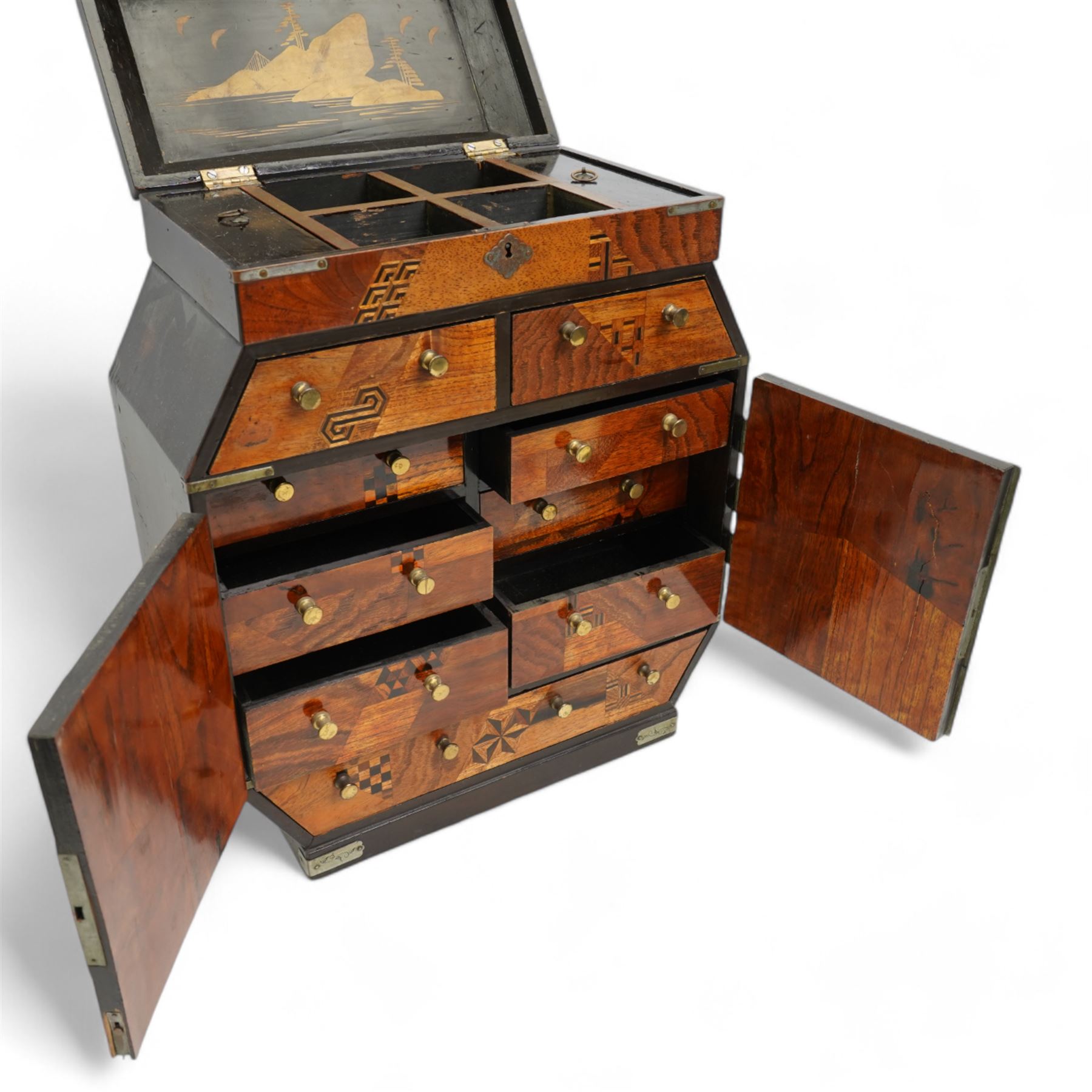 19th/ early 20th century Japanese parquetry and lacquer table cabinet, the brass mounted double doors  inlaid in mother-of-pearl, with a scene of a bird amongst branches, against a black lacquer ground, opening to an arrangement of six drawers, the top with hinged cover, and three further drawers, H36cm, D14cm, W29cm