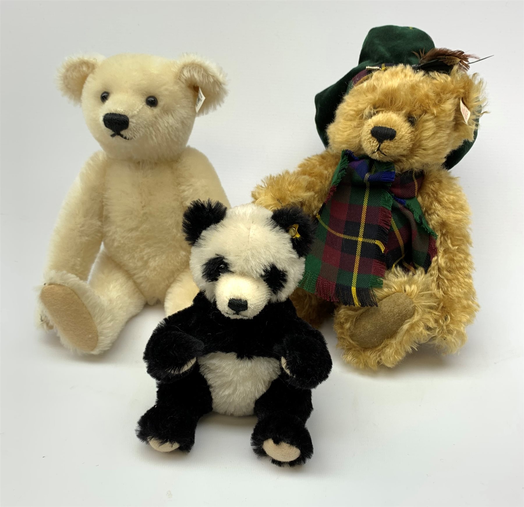 Three modern Steiff teddy bears comprising limited edition white with ...