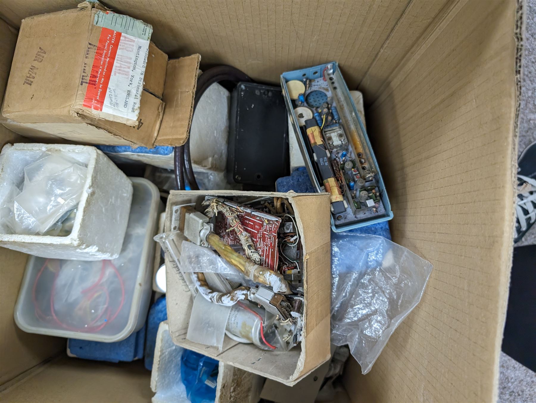 Large collection of radio parts, camera and electrical equipment and similar, together with other electrical parts, etc in five boxes 