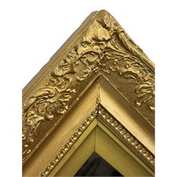 Rectangular wall mirror, in ornate gilt frame decorated with trailing leafy branches and flower heads 