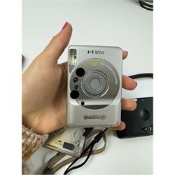 Eight Canon compact Ixus cameras, to include two Ixus examples serial nos. 2309147 & 2273184, Ixus M-1 serial no. 2932566, Ixus L-1 serial no. 2161988, Ixus Z90 serial no. 2201833,  Ixus X-1 serial no. 4704380, Z60IX serial no. 7474817, Ixus V2 serial no. 4431003237 and a Canon Powershot 350 digital camera serial no. H7MX00941