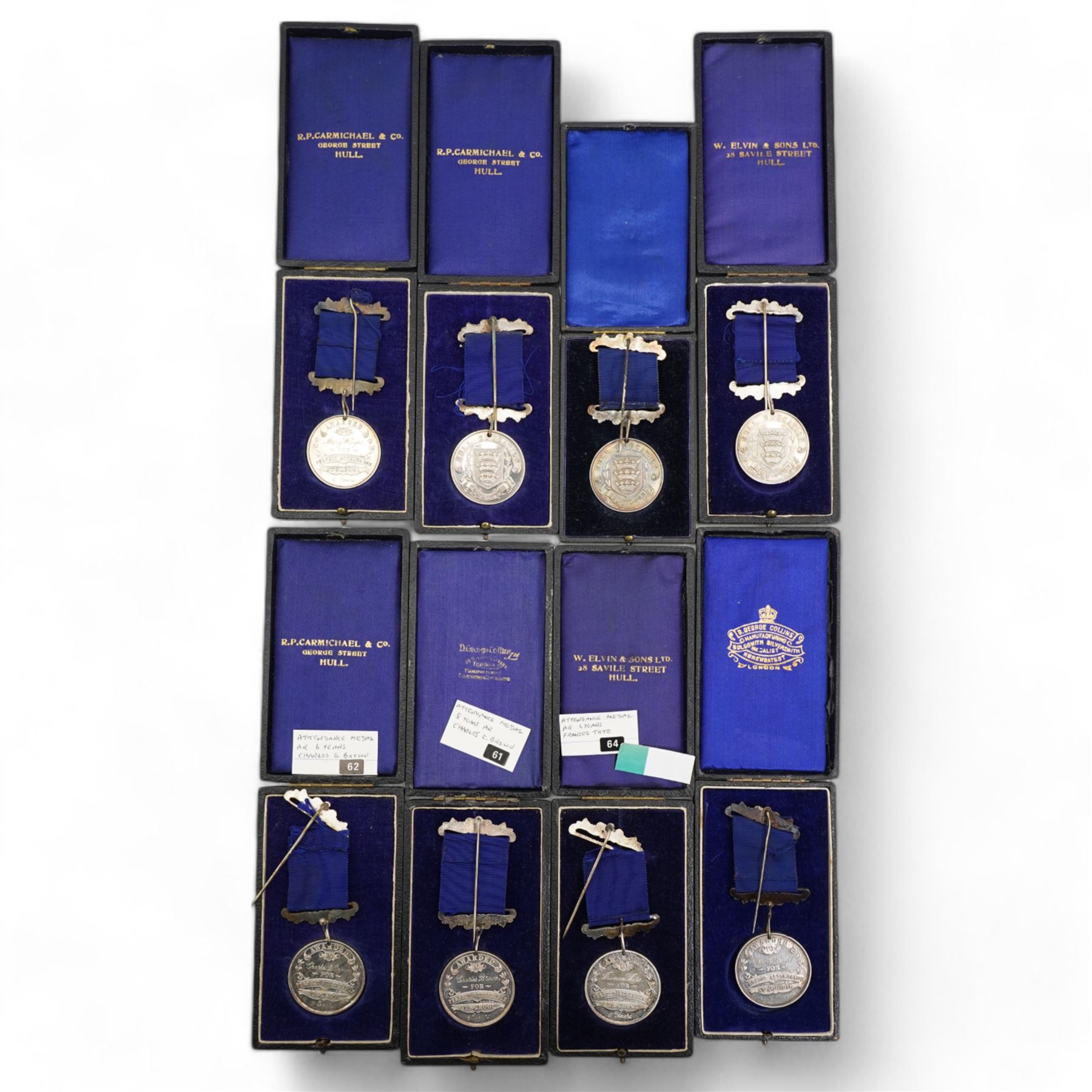 Eight Hull Education Committee 'Perfect Attendance At School' hallmarked silver medallions, each housed in a fitted case