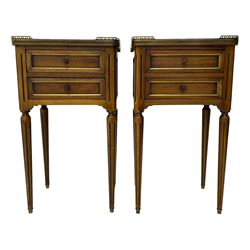 Pair of French design mahogany and marble bedside lamp tables, rectangular white marble top with raised brass gallery, fitted with two drawers, sunken facias with applied brass edging, panelled sides, on turned and fluted tapering supports 