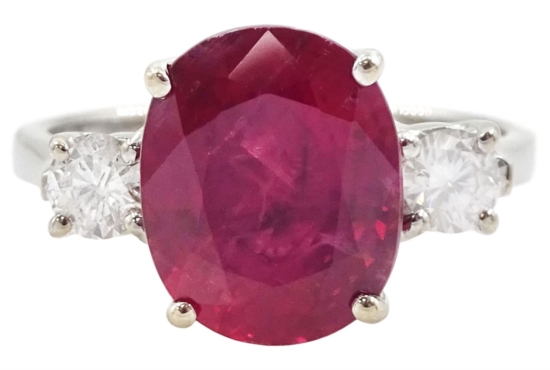 18ct white gold three stone oval cut ruby and round brilliant cut diamond ring, hallmarked, ruby approx 4.30 carat