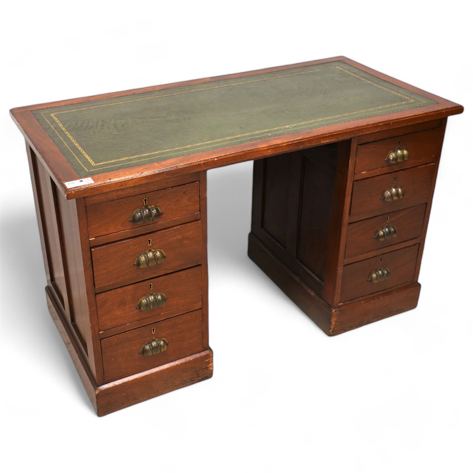 Early 20th century walnut twin pedestal desk, moulded rectangular top with inset green leather writing surface, fitted with eight drawers with brass cup handles, on plinth base