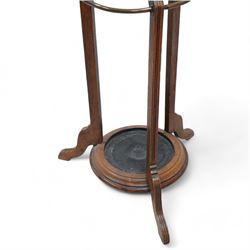 Late 19th century oak hat and coat hallstand, on three shaped and moulded supports with out splayed feet, fitted with hooks and turned finial 