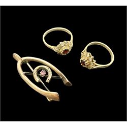 Two 9ct gold garnet and paste stone set cluster rings and a Early 20th century gold brooch, stamped 9ct