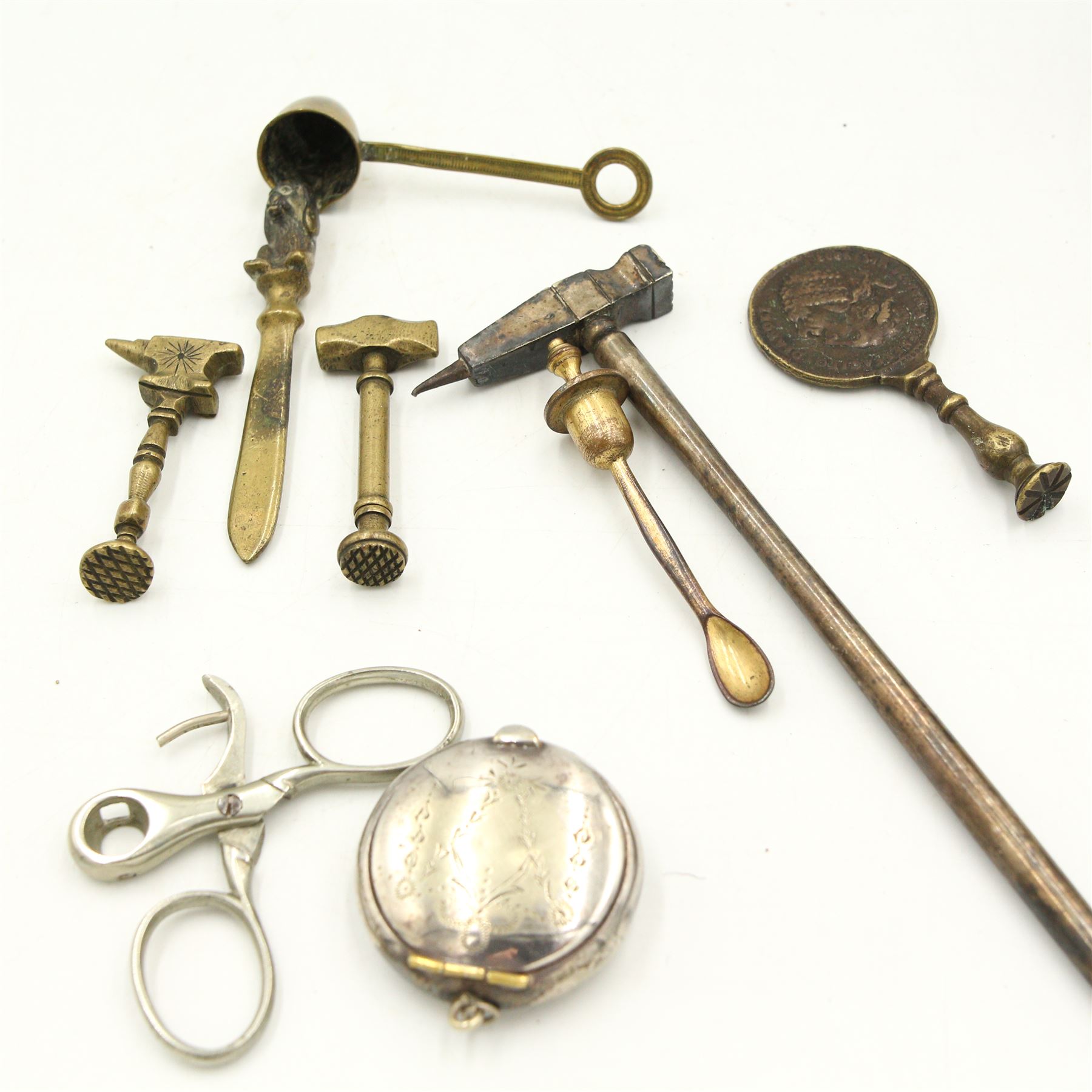 Two miniature Huntley & Palmers biscuit tins, tooled gilt and leather bound lighter, Edwardian silver-plated compact, three 19th century brass pipe tampers, with medallion, anvil and hammer handles, Britains coronation chair, etc 