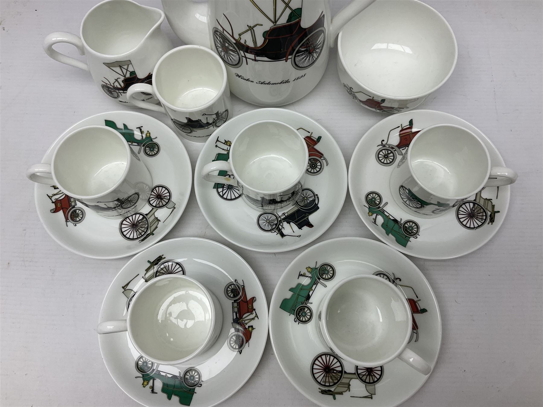 Crown Staffordshire coffee service for six, decorated with motor cars 